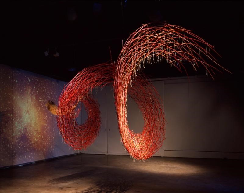 Our Bones Are Made of Stardust.... by Carol Shaw Sutton 1988, installation, 20' x 14' x 12", willow, linen, pigment, projection
